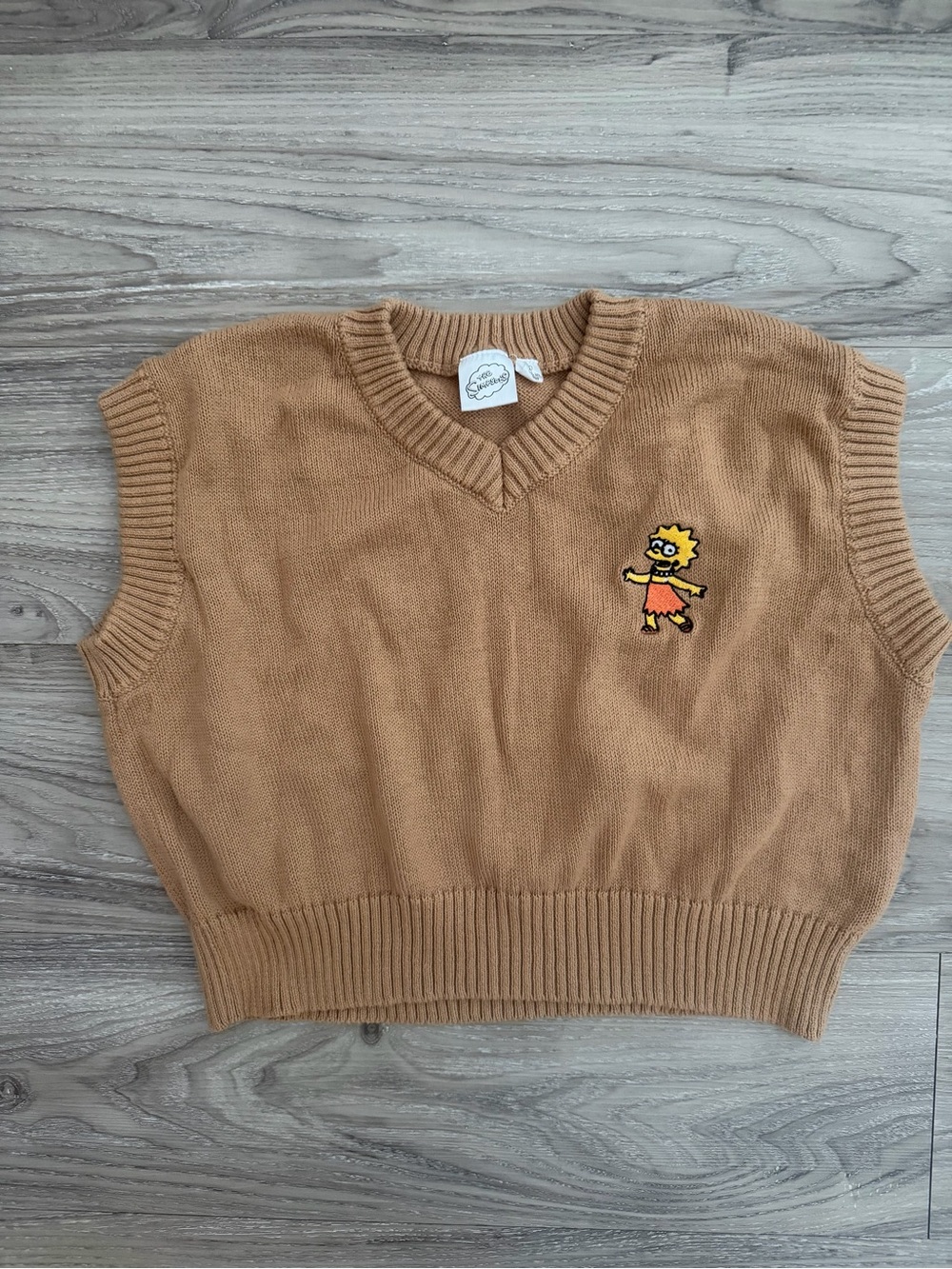 The Simpsons V-Neck Sweater Vest w/ a small embroidered Lisa Simpson patch, sz M